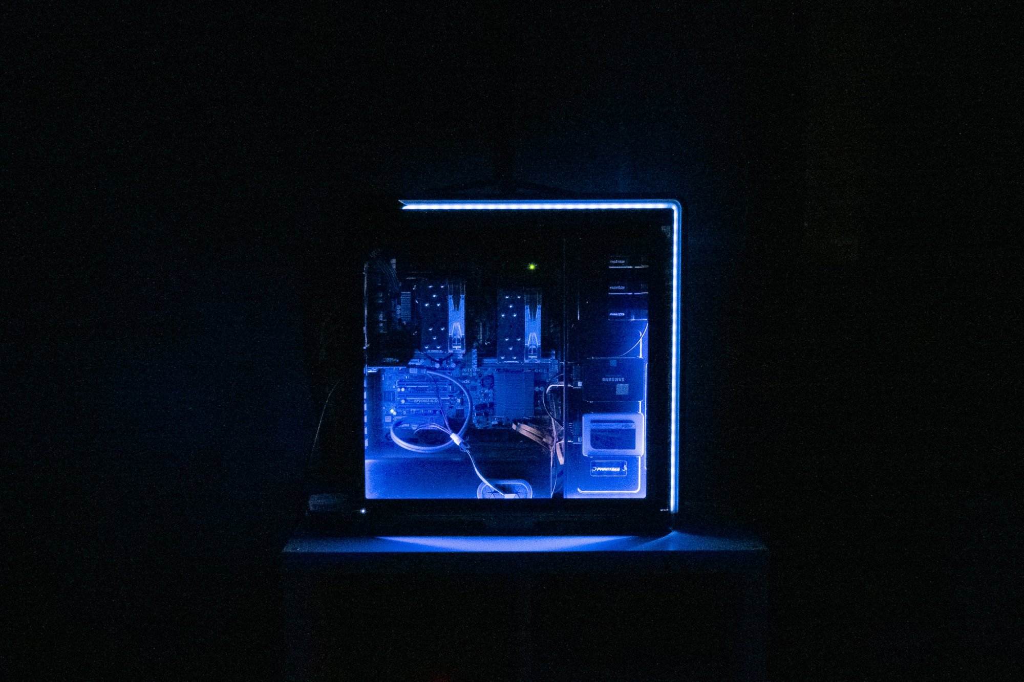 Custom-built home server PC with blue LED lighting in a dark room